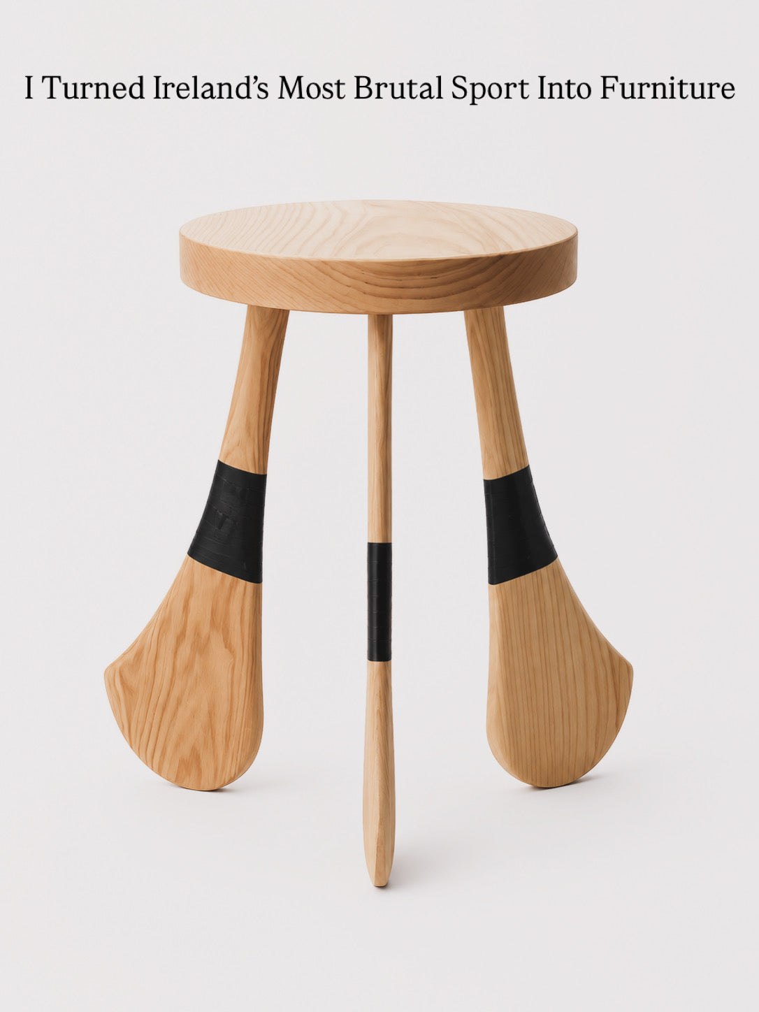 Handcrafted ash wood stool inspired by the shape of a traditional Irish hurley, made in the Mourne Mountains